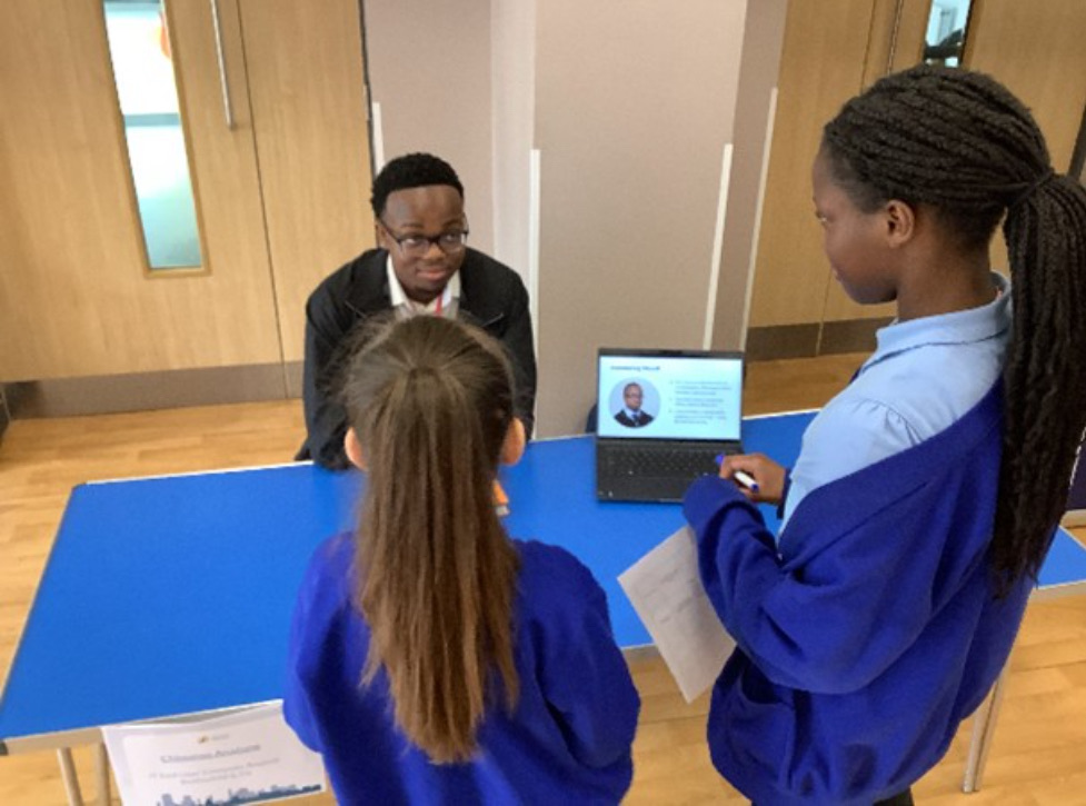Chinonso mentoring students at a careers event
